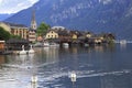 Hallstatt village and swans reflections into the lake, Austria