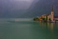 Hallstatter lake and Hallstatt village with cloudy sky in Austrian Alps. Royalty Free Stock Photo