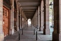 Hallway with geometric columns and diminishing perspective. Walkway arch style Royalty Free Stock Photo