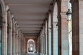 Hallway with geometric columns and diminishing perspective. Walkway arch style. Outdoor dining Royalty Free Stock Photo