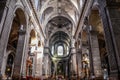 Hallway of the historic church with arcs and sculptures and engravings in Nancy in France