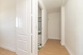 hallway of a house with light oak flooring with access doors to different rooms Royalty Free Stock Photo