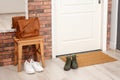Hallway interior with shoes, bag and mat Royalty Free Stock Photo
