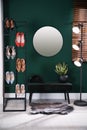 Hallway interior with storage rack, stylish women`s shoes and bench