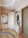 Hallway in modern style with hangers, a mirror dressing table an