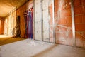 Hallway in residential building under construction with pipe system of floor heating Royalty Free Stock Photo