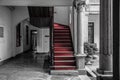 The hallway and staircase laid with red carpet Royalty Free Stock Photo