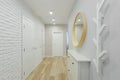 Hallway with white interior doors in the apartment