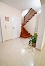 Hallway with wooden stairs to upper floors