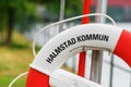 Halmstad, Sweden - August 19, 2022: Halmstad city lifebuoy on the banks of river Nissan