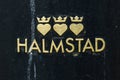 Halmstad city logo on public trash can. Illustrative editorial