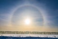 Halo around sun on blue sky in winter time Royalty Free Stock Photo