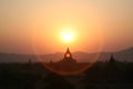 A halo of Burma sunset over Bagan pagodas