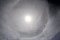 The halo is a circle around the sun as a rare natural phenomenon in the sky.