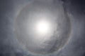 The halo is a circle around the sun as a rare natural phenomenon in the sky. Royalty Free Stock Photo