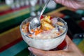 Halo-halo is a colorful Filipino beverage of crushed ice an mixtures of bean, jello, milk and many more