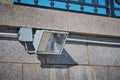 A halogen spotlight mounted on the granite wall of the city embankment. Electrical cable and insulation. Decorative