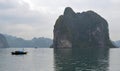 Halong Bay - Vietnam - Large Karsts and small traditional fishing boat