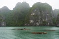 Halong Bay in mystical clouds. Mystical atmoshpere in the world famous halong bay.