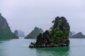 Halong Bay in mystical clouds. Mystical atmoshpere in the world famous halong bay.