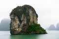 Halong Bay in mystical clouds. Mystical atmoshpere in the world famous halong bay.