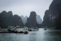 Halong Bay in mystical clouds. Mystical atmoshpere in the world famous halong bay.