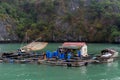 Halong Bay in mystical clouds. Traditional fishermens village in ther sea. Mystical atmoshpere in the world famous halong bay. t Royalty Free Stock Photo