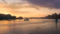 Halong bay at sunrise in Vietnam, South Asia, and Tourist Junks. Panoramic view. Travel destination and natural background Royalty Free Stock Photo