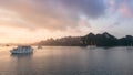 Halong bay at sunset in Vietnam, South Asia, and Tourist Junks. Panoramic view. Travel destination and natural background Royalty Free Stock Photo