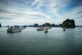 Halong bay with tourist junks and rocky islands. Popular landmark, famous destination of Vietnam Royalty Free Stock Photo