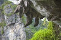 Halong bay traditional fishing boats, UNESCO world natural heritage, Vietnam. Tourist cruise ships sailing among limestone Royalty Free Stock Photo