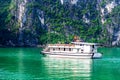 HALONG BAY, VIETNAM - SEPTEMBER 24, 2014 - Tourist ship cruising inside the Bay.