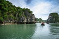 Halong bay in Vietnam, UNESCO World Heritage Site, with tourist rowing boats