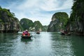 Halong bay in Vietnam, UNESCO World Heritage Site, with tourist rowing boats