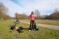 Halting girl with a bicycle Royalty Free Stock Photo