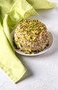 Halva with chopped pistachios with green napkin on side