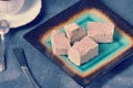 Halva chopped into slices on a plate