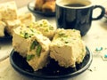 Halva pistachio and cup of coffee Royalty Free Stock Photo