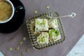 Halva pistachio and cup of coffee Royalty Free Stock Photo