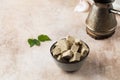 Halva slices in a bowl. Oriental sweetness. Copy space.