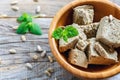 Halva from sunflower seeds in a wooden bowl.