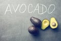 Halved avocado on blackboard