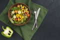 halved bell pepper mixed vegetable salad green napkin black concrete backdrop. High quality photo