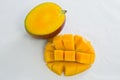 Halved and chopped mango on white background Royalty Free Stock Photo