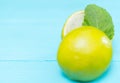 Halved fresh lime or lemon with mint Royalty Free Stock Photo