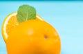 Halved fresh orange with mint Royalty Free Stock Photo