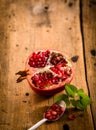 Halved fresh pomegranate with seeds