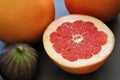 Halved grapefruit, juicy grapefruit, citrus, citrus peel, fresh fig fruit, natural vitamins