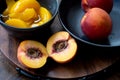 Halved peach with sliced and whole ones Royalty Free Stock Photo