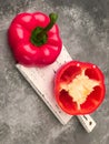 Halved red bell pepper on a cutting board